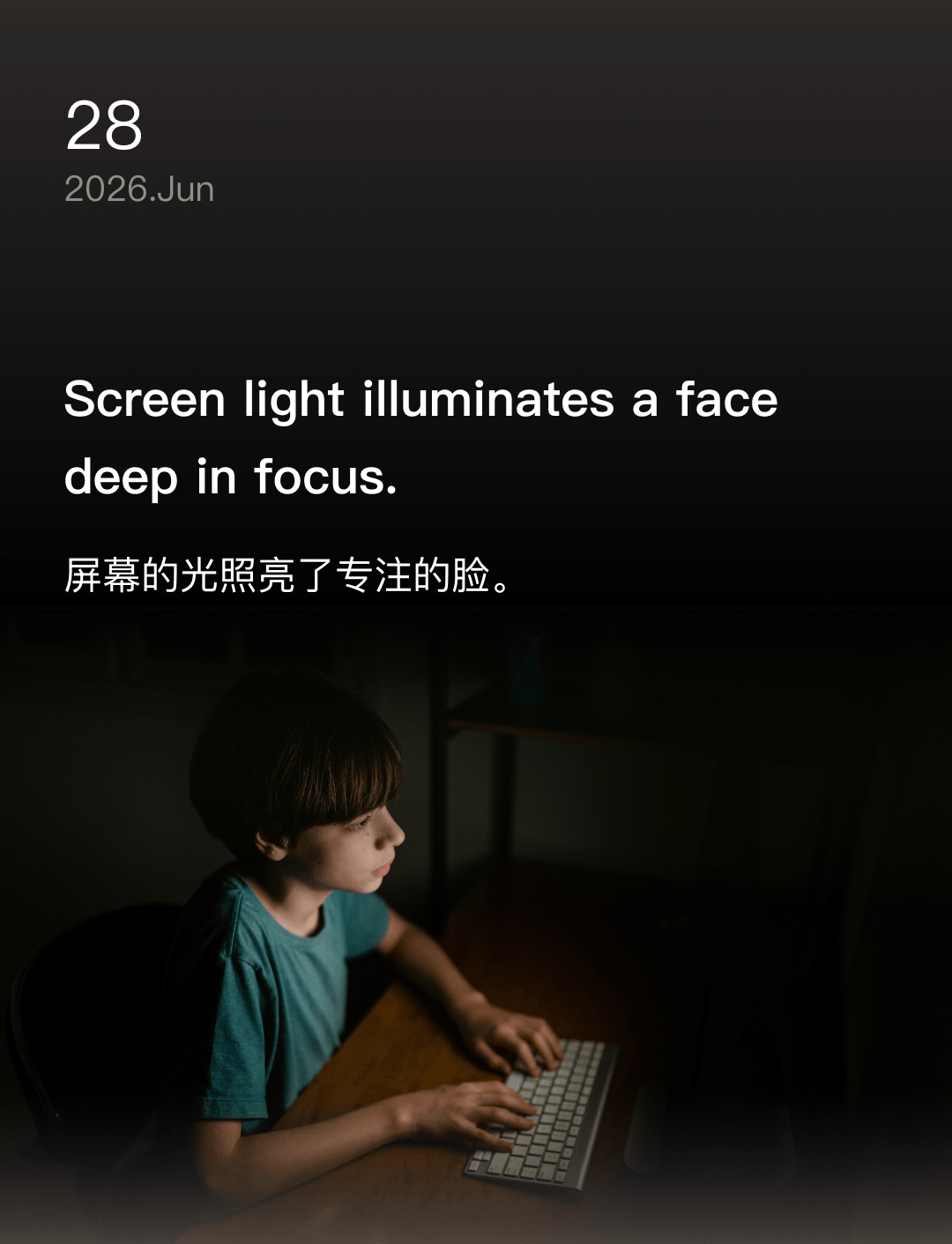 Screen light illuminates a face deep in focus.
